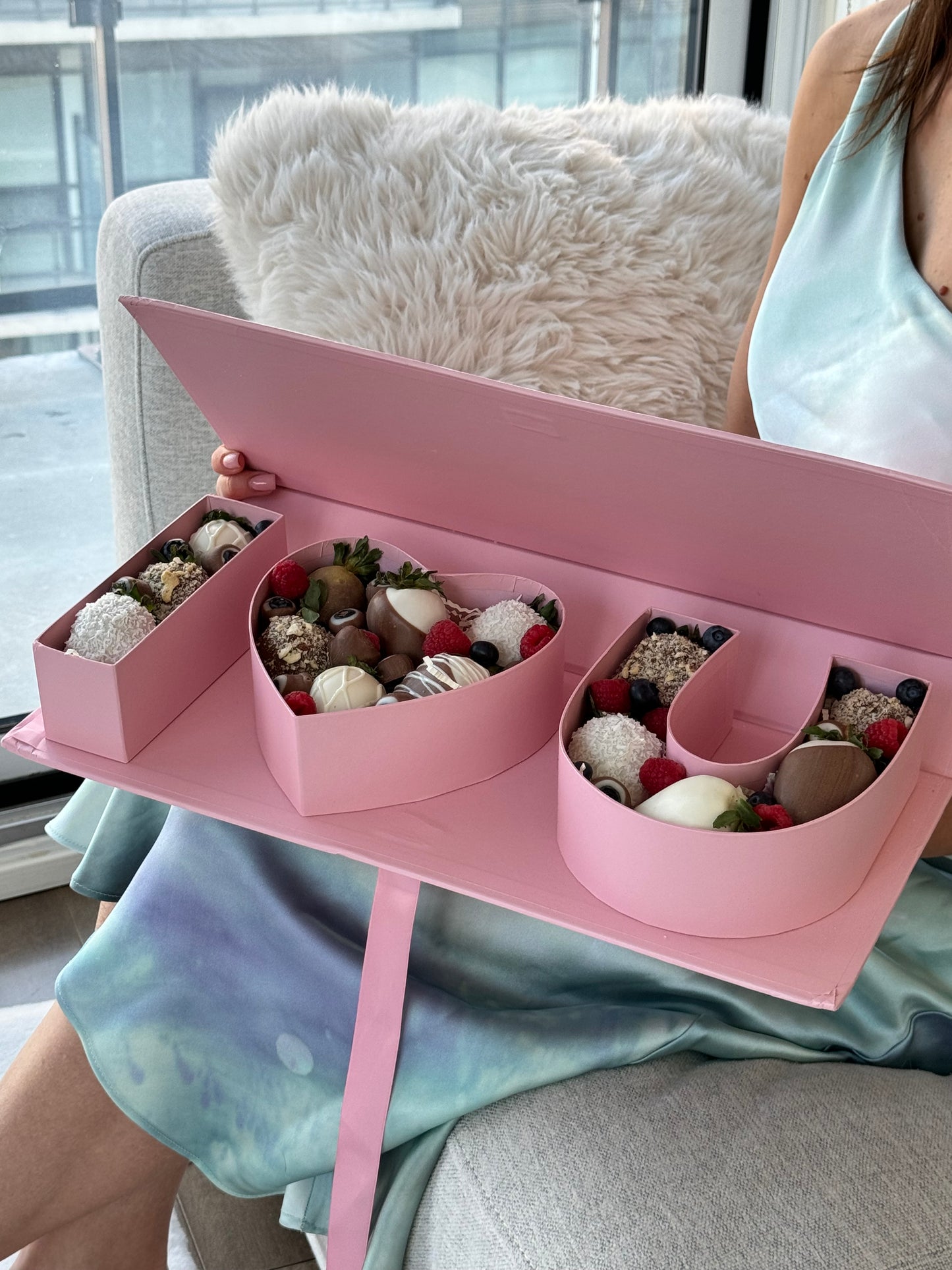 pink box with chocolate covered strawberries 