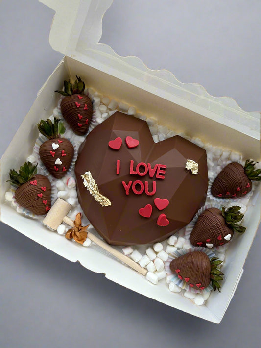 Chocolate smash heart and dipped strawberries with red chocolate letters I Love You 