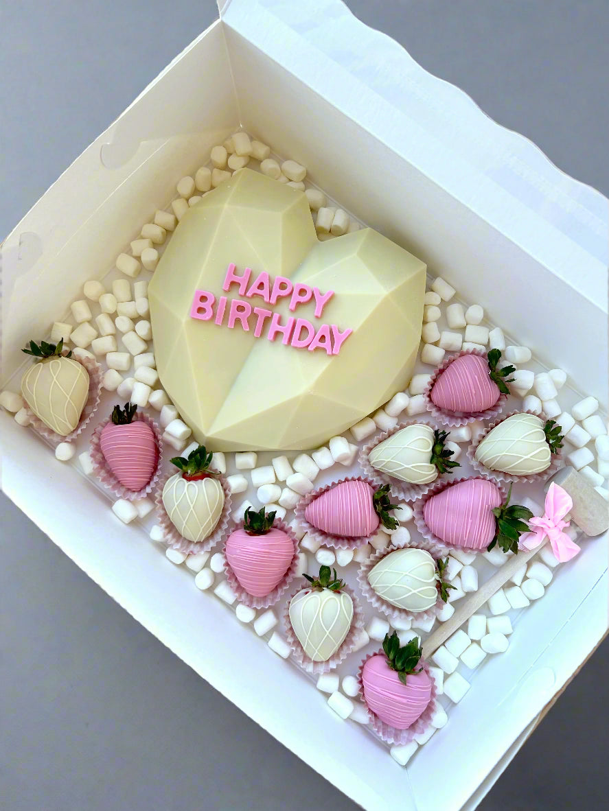 Sweet treats in white box with marshmallows 