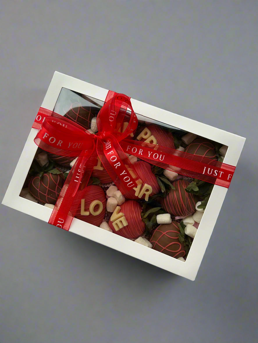 box with ribbon and bow on grey background