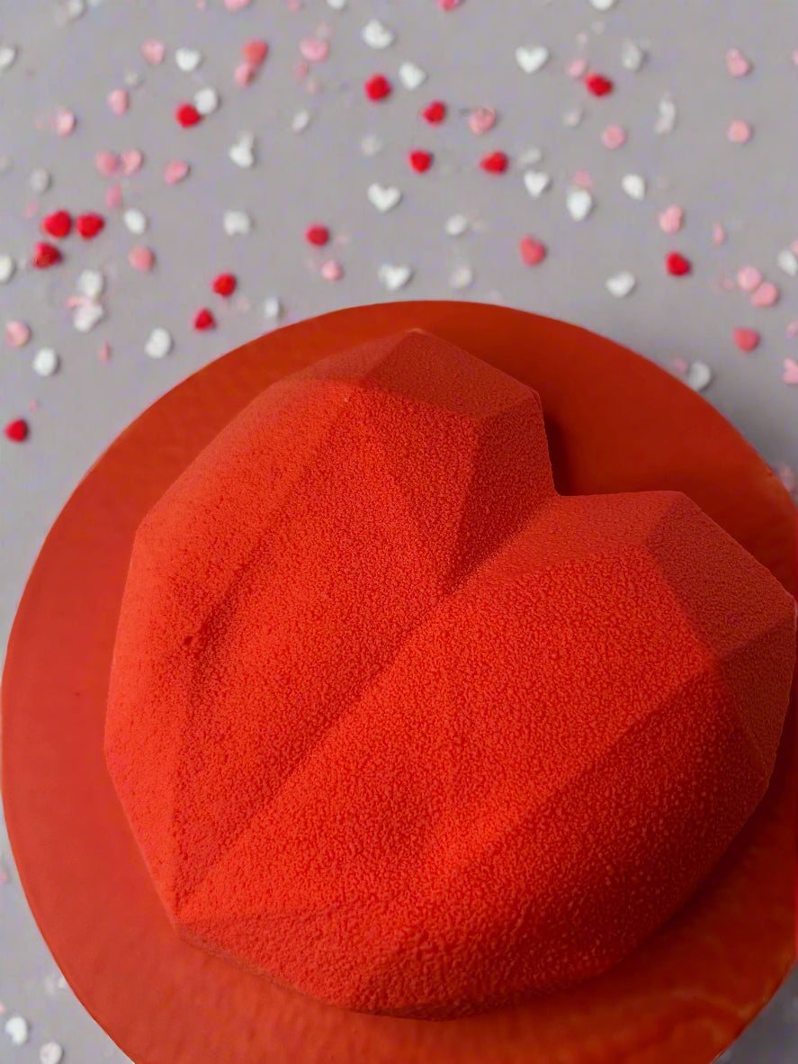 mousse cake on grey background with little hearts 