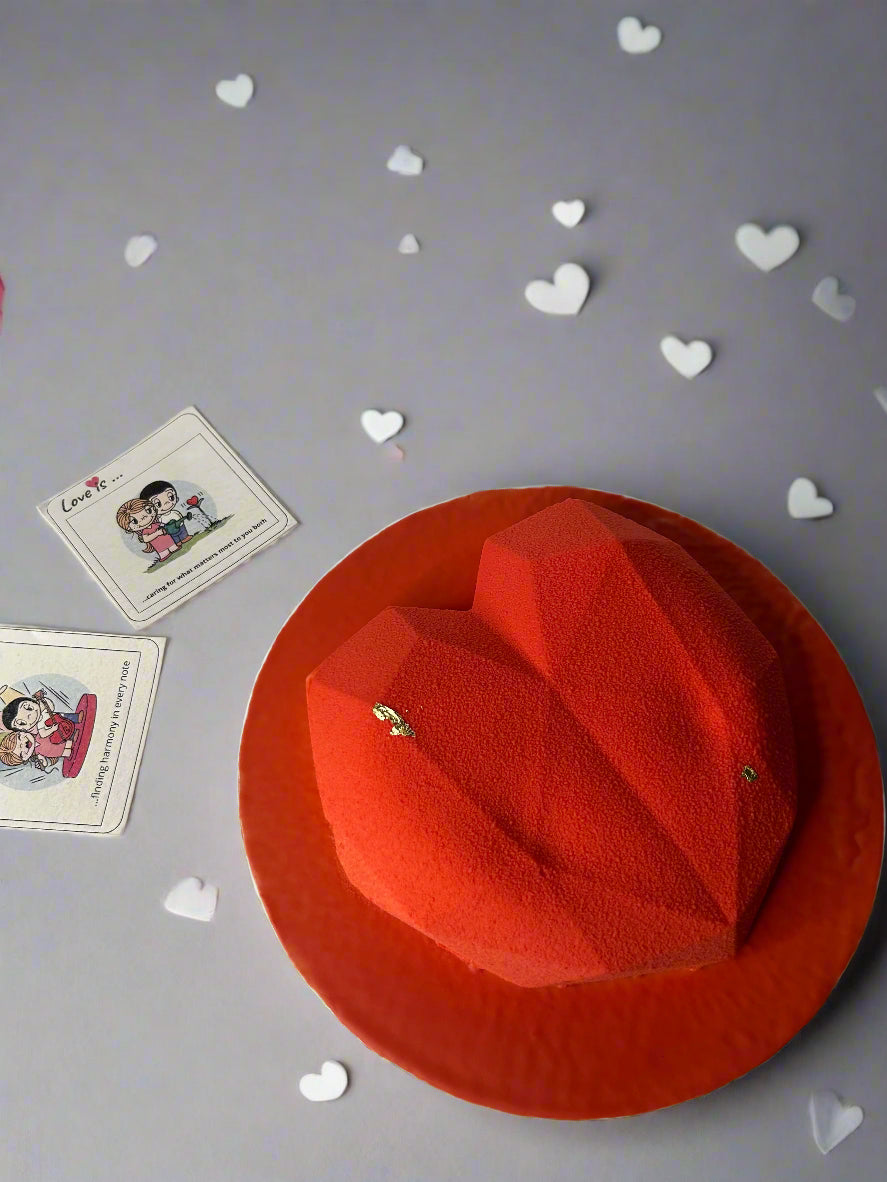 Heart shaped mousse cake on grey background with cards 