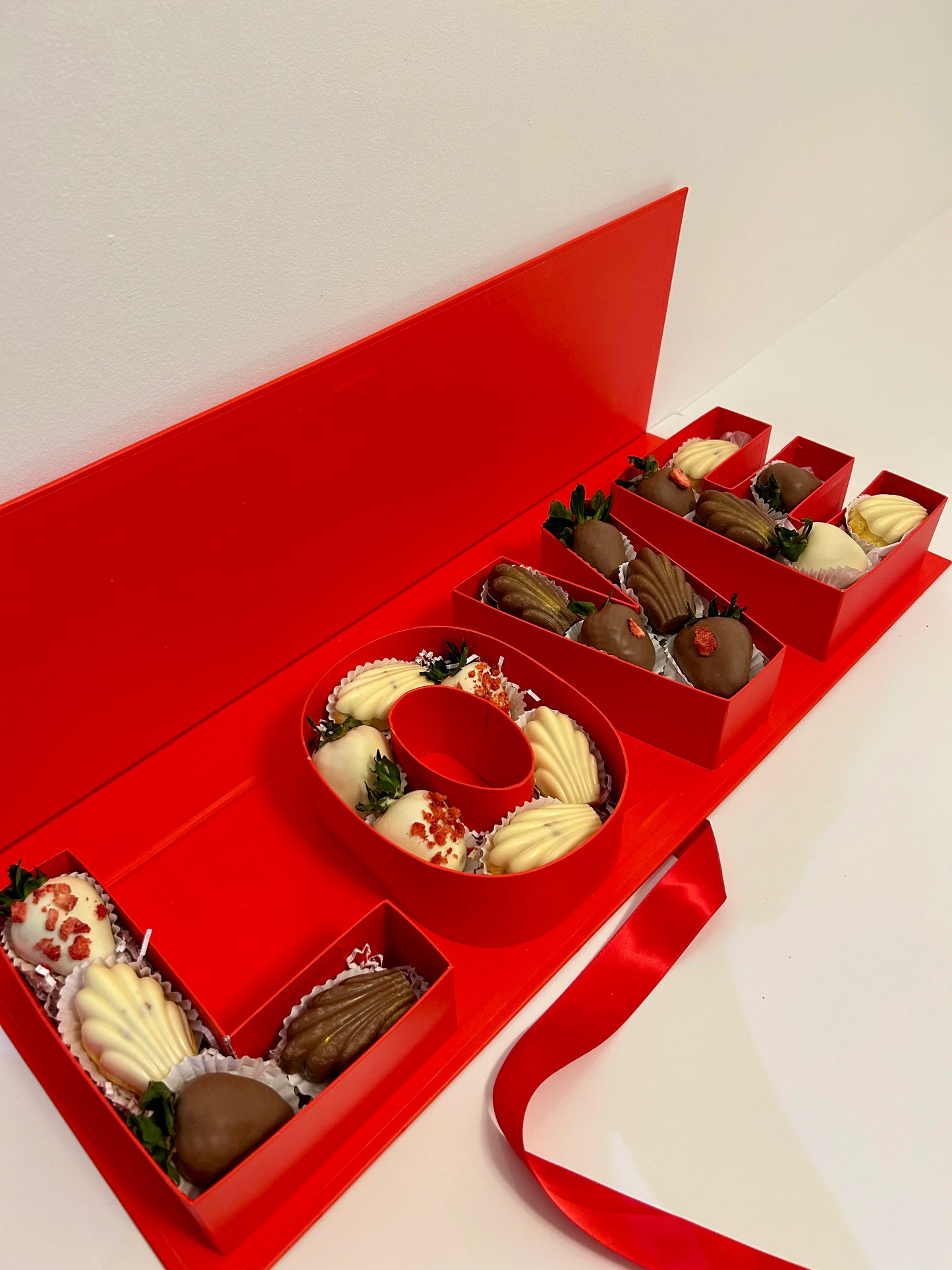 love luxury box with chocolate covered strawberries and Madeleines