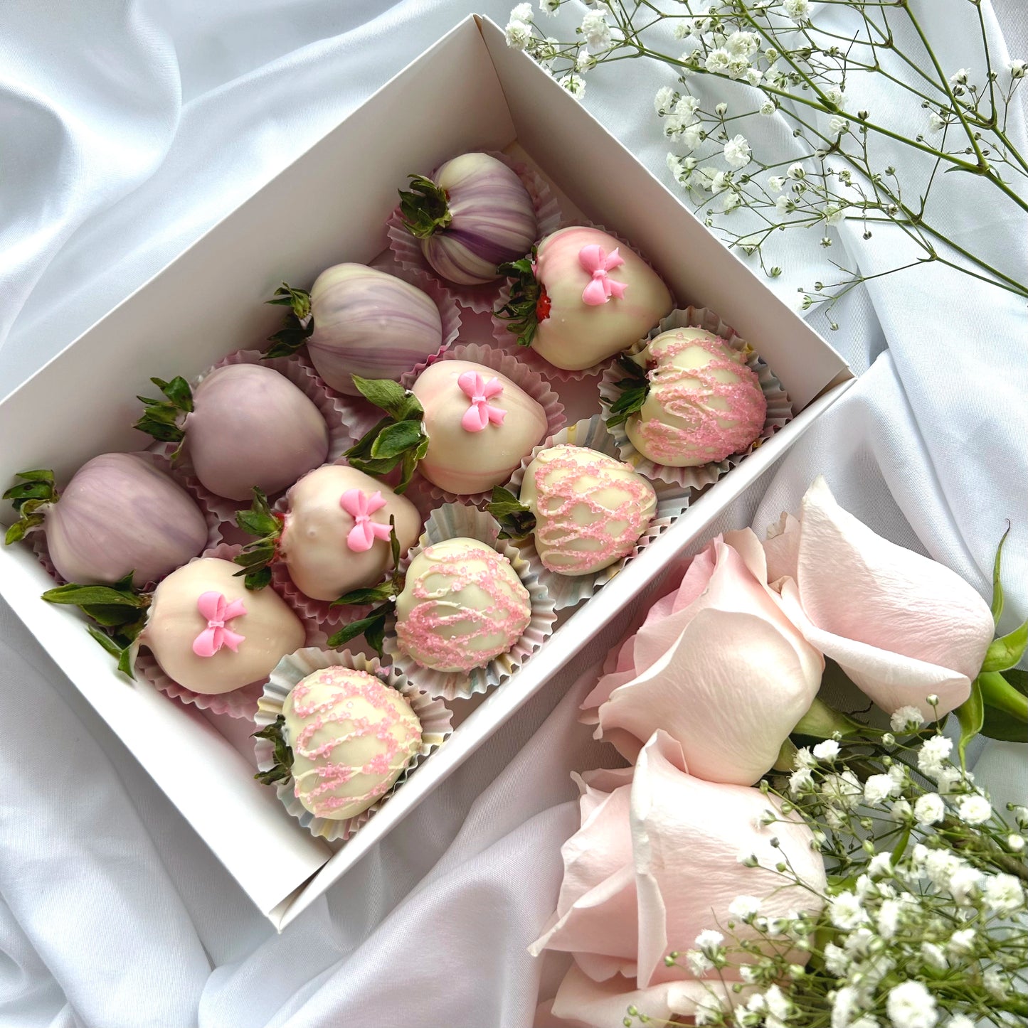 12 chocolate covered strawberries pink and purple colours with cute pink bows
